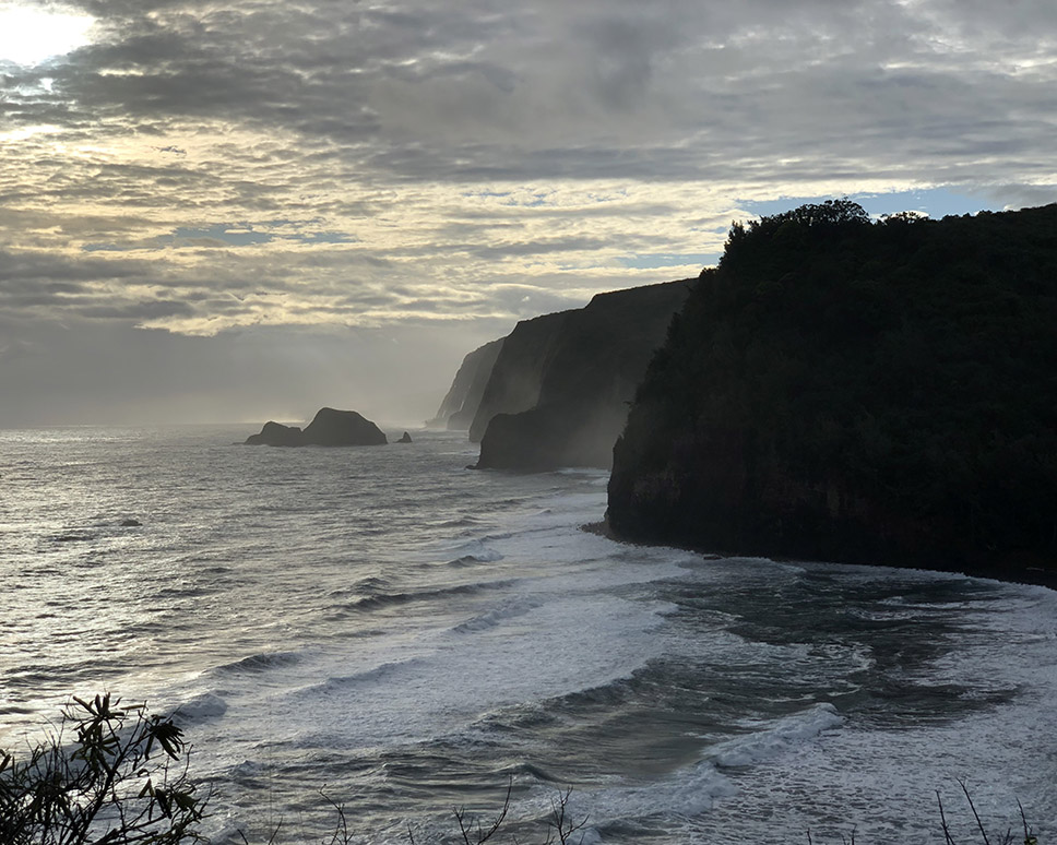 Steep ocean cliffs seen at sunset