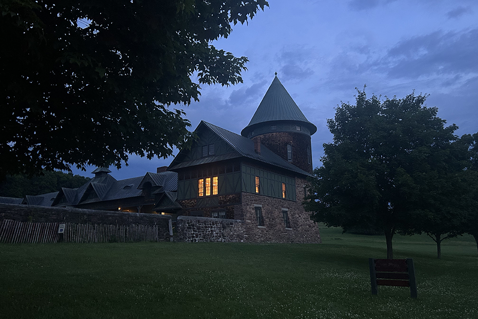 Farm Barn north tower pre-dawn, with lights on in windows