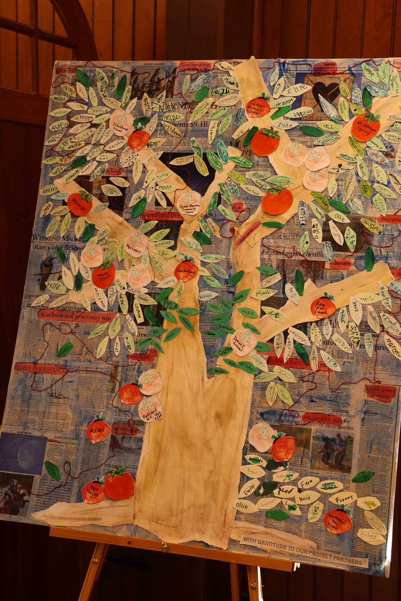 A collaged artwork depicting a persimmon tree