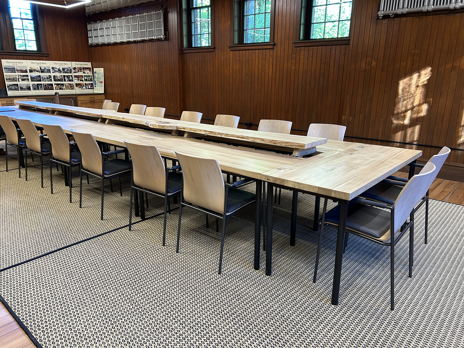 a meeting room with a long table and surrounding chairs