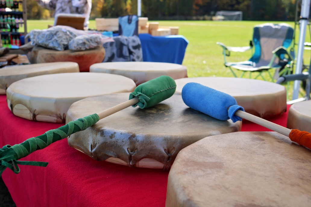 A set of drums resting on a table in an outdoor setting.