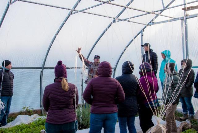 Group in a greenhouse in Maine