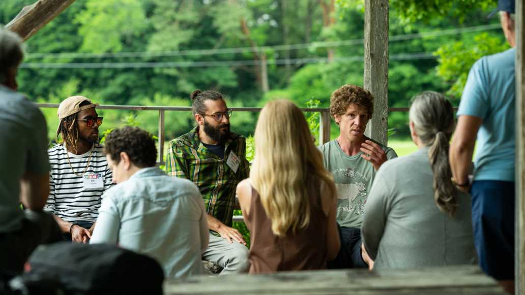 Educators gather in a garden space