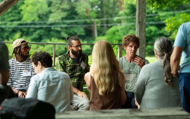Educators gather in a garden space