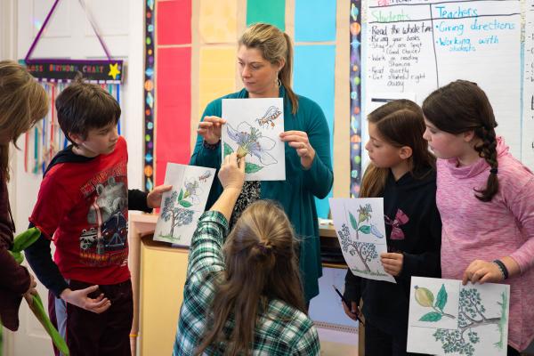 Students and teachers explore the steps of pollination. Photo by Sarah Webb.