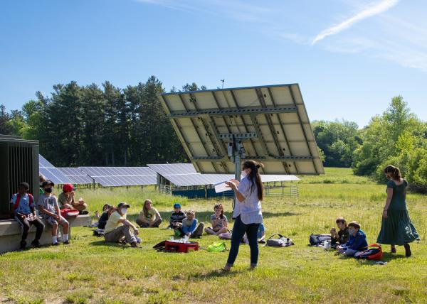 Sustainability Academy fourth grade students discuss the electricity generated by the Shelburne Farms Solar Orchard with Joanne Cucinotta.