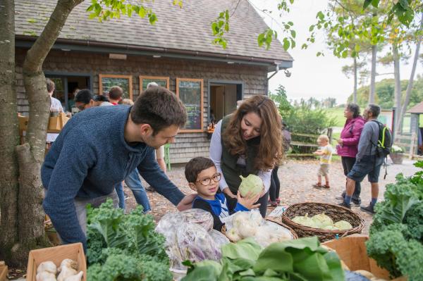 Family buying produce at Shelburne Farms Farm Store