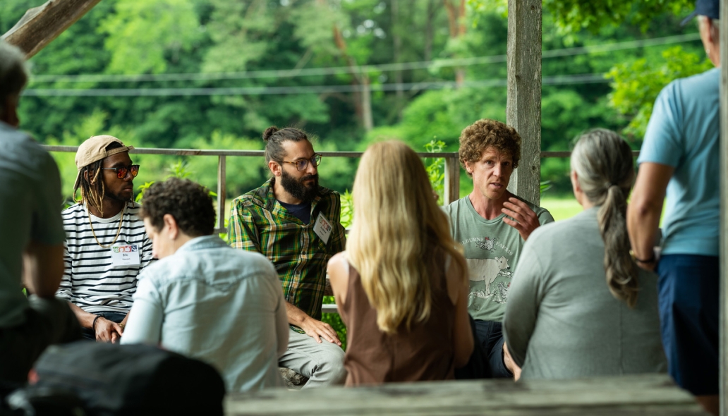 Educators gather in a garden space